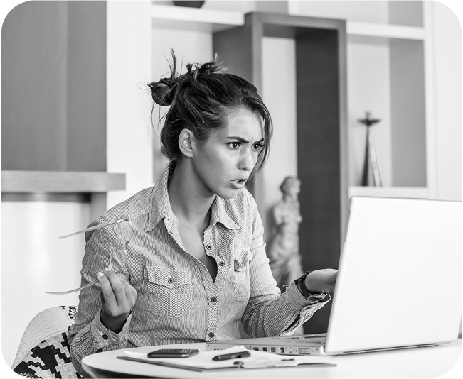 Young businesswoman frustrated on laptop